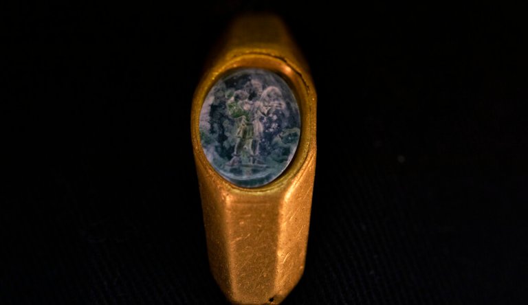 A Roman gold ring, its green gemstone carved with the figure of a shepherd carrying a sheep on his shoulders, dating to around 1,700 years ago, is displayed after it was found near the ancient city of Caesarea.