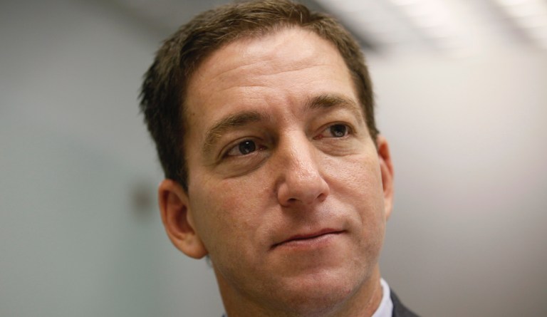 Glenn Greenwald, a reporter of The Guardian, speaks during an interview in Hong Kong Monday, June 10, 2013. 