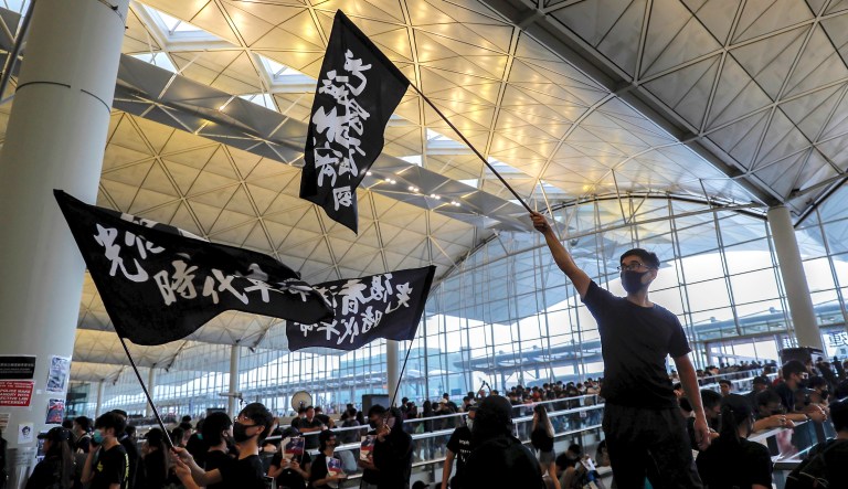 A student dressed in black gather on the University Mall at the Chinese University of Hong Kong (CUHK) during a class boycott rally in Hong Kong, China, on Monday, Sept. 2, 2019.