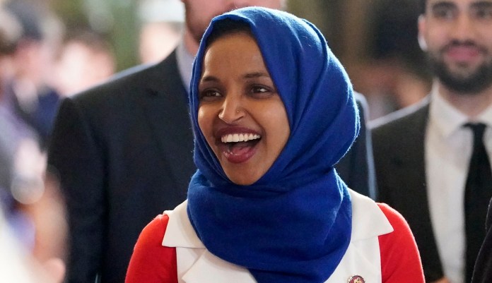 In this Feb. 5, 2019 photo, Rep. Ilhan Omar, D-Minn., arrives for President Donald Trump's State of the Union address to a joint session of Congress on Capitol Hill in Washington. 