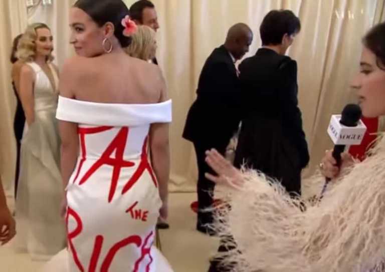 AOC dons a dress reading 