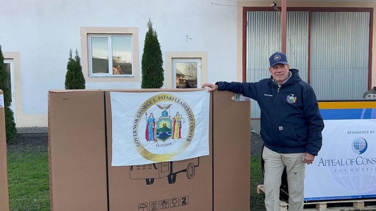 Former Gov. George Pataki with an industrial heater on a humanitarian trip to Ukraine.