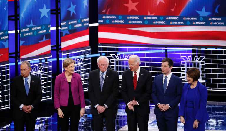From left, Democratic presidential candidates, former New York City Mayor Michael Bloomberg, Sen. Elizabeth Warren, D-Mass., Sen. Bernie Sanders, I-Vt.,former Vice President Joe Biden, former South Bend Mayor Pete Buttigieg, Sen. Amy Klobuchar, D-Minn., stand on stage before a Democratic presidential primary debate Wednesday, Feb. 19, 2020, in Las Vegas, hosted by NBC News and MSNBC. (AP Photo/John Locher)