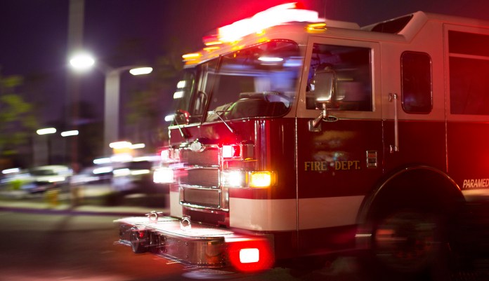 A fire truck races to the scene of an accident.