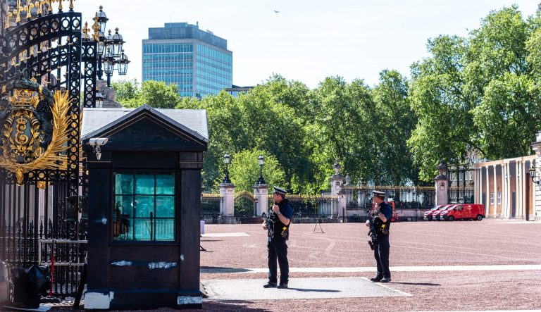 Armed policemen guarding the gates of Buckingham Palace in London on May 14, 2019.