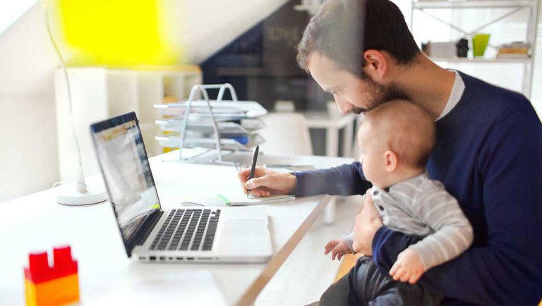 A baby spending time in his father's office.