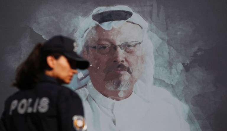 Activists, members of the Human Rights Association Istanbul branch, holding posters with photos of missing Saudi journalist Jamal Khashoggi, talk to members of the media, during a protest in his support near the Saudi Arabia consulate in Istanbul, Tuesday, Oct. 9, 2018.