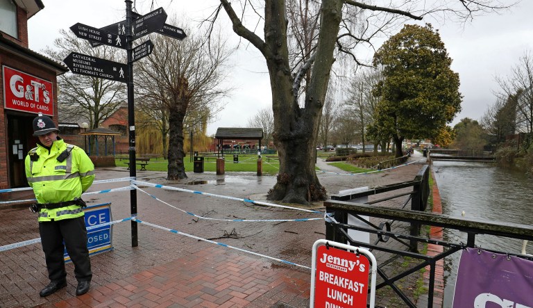 A police officer at a cordon near the Maltings in Salisbury, England,  Friday March 30, 2018, where Russian former double agent spy Sergei Skripal and his daughter Yulia were found on a bench after they were attacked with a nerve agent. The former Russian spy and his daughter who were victims of a nerve agent attack first came into contact with the deadly chemical at his home, police said as investigations continue.