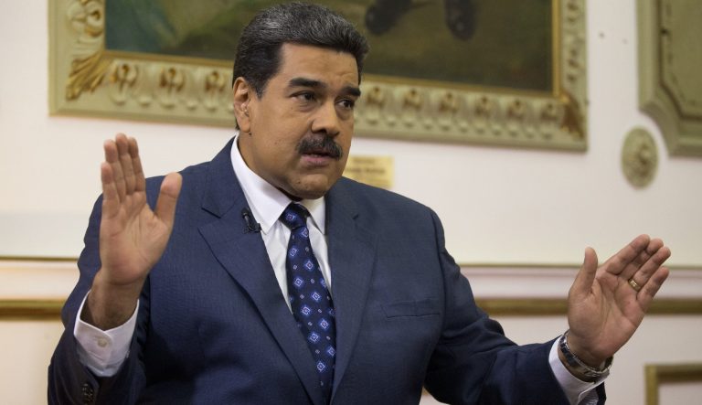 Venezuela's President Nicolas Maduro speaks during an interview with the Associated Press at Miraflores presidential palace in Caracas, Venezuela, Thursday, Feb. 14, 2019. 