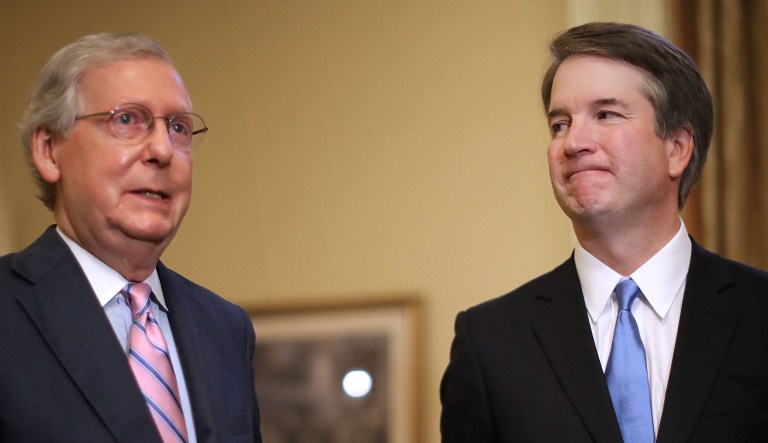 Brett Kavanaugh, U.S. Supreme Court associate justice nominee for U.S. President Donald Trump, right, listens as Senate Majority Leader Mitch McConnell, a Republican from Kentucky, speaks during a meeting at the U.S. Capitol in Washington, D.C., U.S., on Tuesday, July 10, 2018.