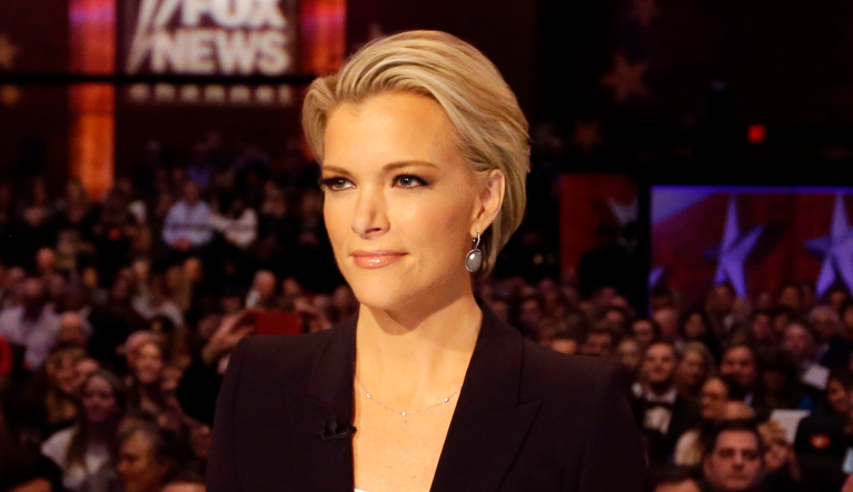 FILE - In this Jan. 28, 2016 photo, Moderator Megyn Kelly waits for the start of the Republican presidential primary debate in Des Moines, Iowa.Kelly says she did the âtwirlâ before Roger Ailes, too. The former Fox News Channel personality referred to a scene in the movie âBombshell,â where the late Fox News boss, portrayed by John Lithgow, asked an aspiring news anchor played by actress Margot Robbie to turn around in front of him so he could assess her body. (AP Photo/Chris Carlson, File)
