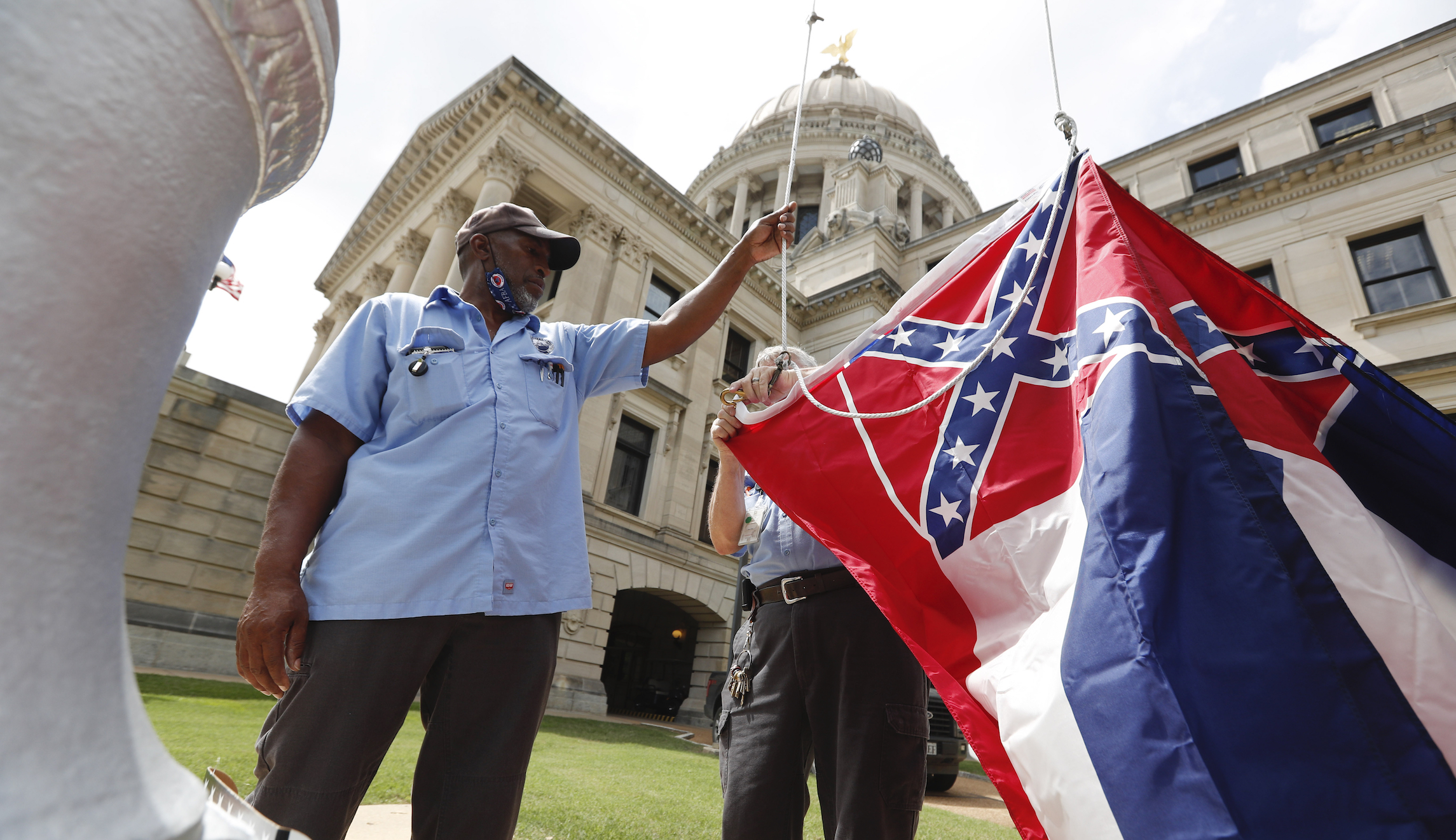 Mississippi governor signs bill removing Confederate emblem from flag