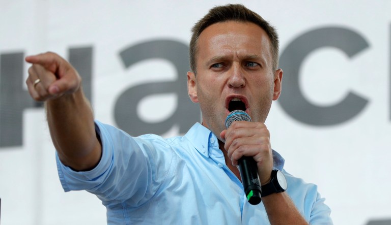 In this Jan. 28, 2018, file photo, Russian opposition leader Alexei Navalny, centre, attends a rally in Moscow, Russia. Navalny is an anti-corruption campaigner and the Kremlinâs fiercest critic. He has outlasted many opposition figures and is undeterred by incessant attempts to stop his work.