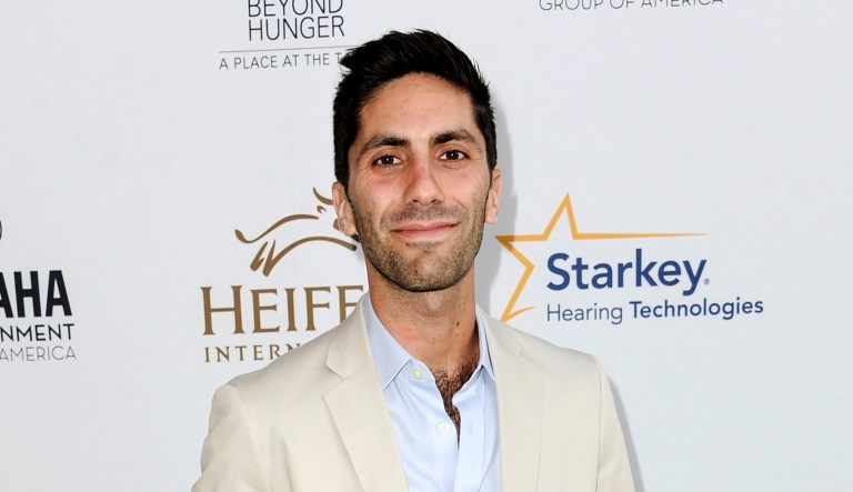 FILE - In this Aug. 22, 2014 file photo, Nev Schulman, executive producer of the MTV series "Catfish: The TV Show," arrives at the 3rd Annual Beyond Hunger "A Place At The Table" gala in Beverly Hills, Calif.  MTV has temporarily suspended shooting the show while it investigates sexual misconduct accusations made by a woman who appeared on air three years ago. Schulman denied the allegations in a statement Thursday, May 17, 2018.