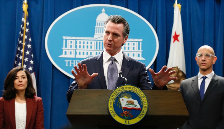 Gov. Gavin Newsom discusses the reopening of businesses during a news conference at Twiggs Floral Design Gallery in Sacramento, Calif., Friday, May 8, 2020. Newsom spoke about his administration's guidance allowing retailers, including flower shops, to begin opening Friday with restrictions like curbside pickup.