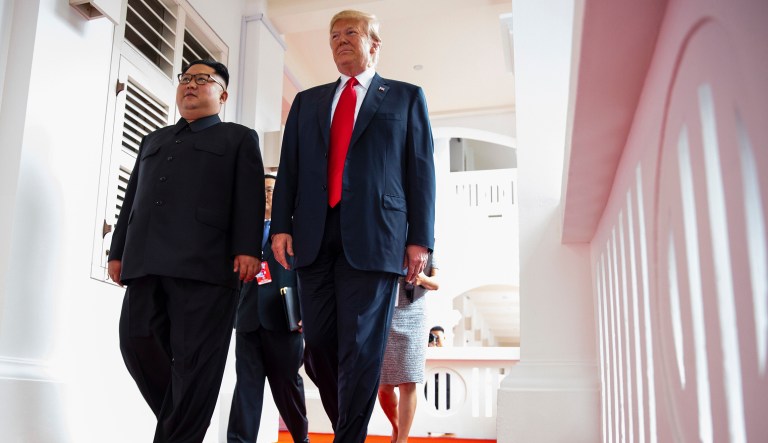 North Korea leader Kim Jong Un and U.S. President Donald Trump walk along the balconies at the Capella resort on Sentosa Island Tuesday, June 12, 2018 in Singapore.