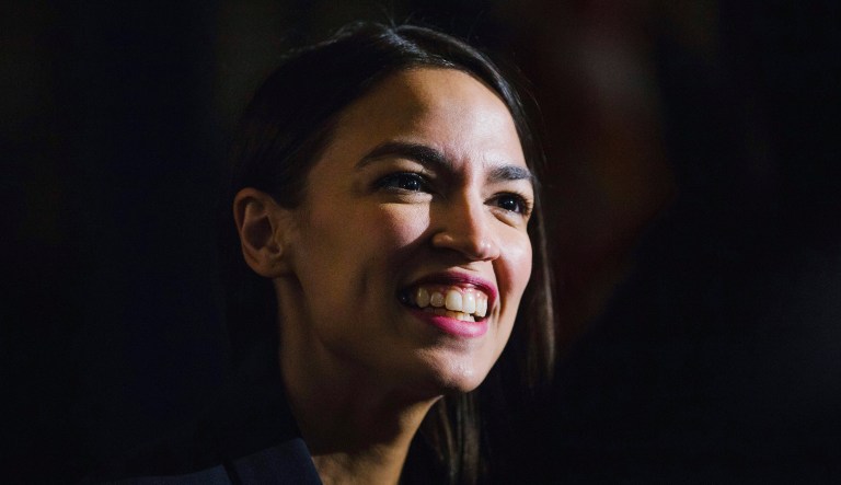 In this Saturday, Feb. 16, 2019 file photo, Rep. Alexandria Ocasio-Cortez, D-N.Y., delivers her inaugural address following her swearing-in ceremony at the Renaissance School for Musical Theater and Technology in the Bronx borough of New York.