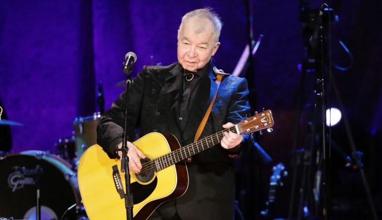 FILE â In this Sept. 11, 2019, file photo, John Prine performs at the Americana Honors & Awards show in Nashville, Tenn. Prine died Tuesday, April 7, 2020, from complications of the coronavirus. He was 73. 
