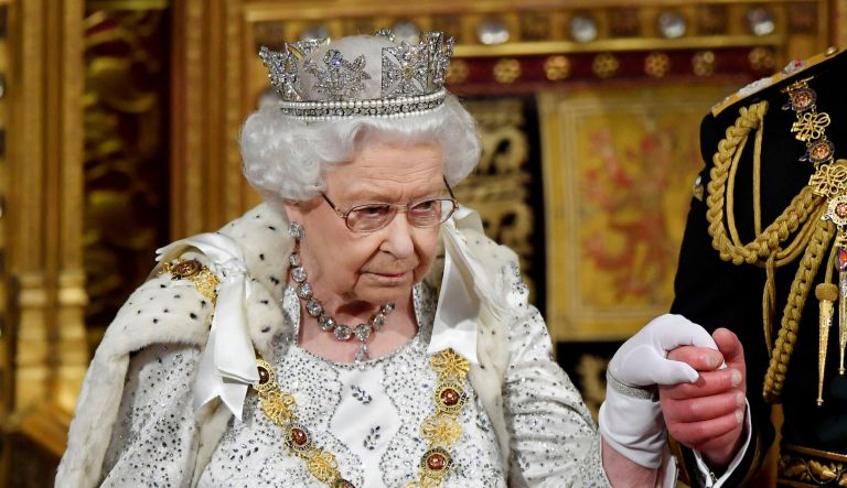 Queen Elizabeth II, accompanied by Prince Charles, leaves after delivering the Queen's Speech during the official State Opening of Parliament in London, Monday Oct. 14, 2019.