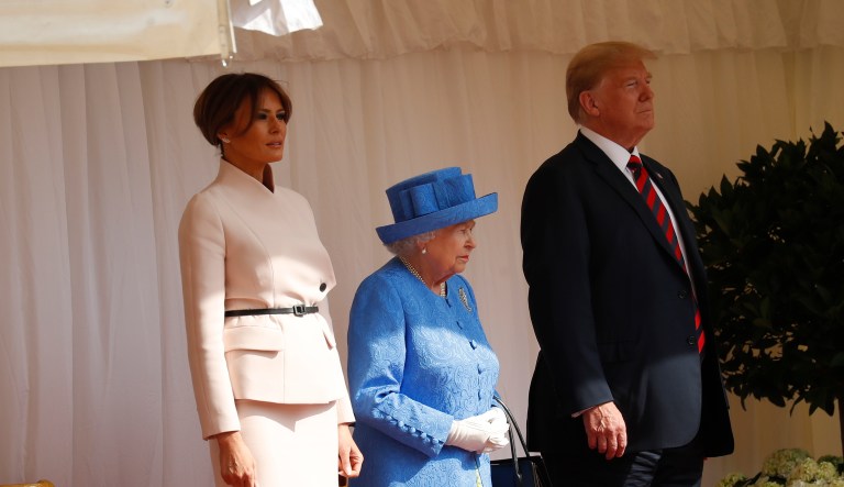 U.S. President Donald Trump, first lady Melania Trump, with Queen Elizabeth II, stand during an arrival ceremony with the Guard of Honour at Windsor Castle in Windsor, England, Friday, July 13, 2018.