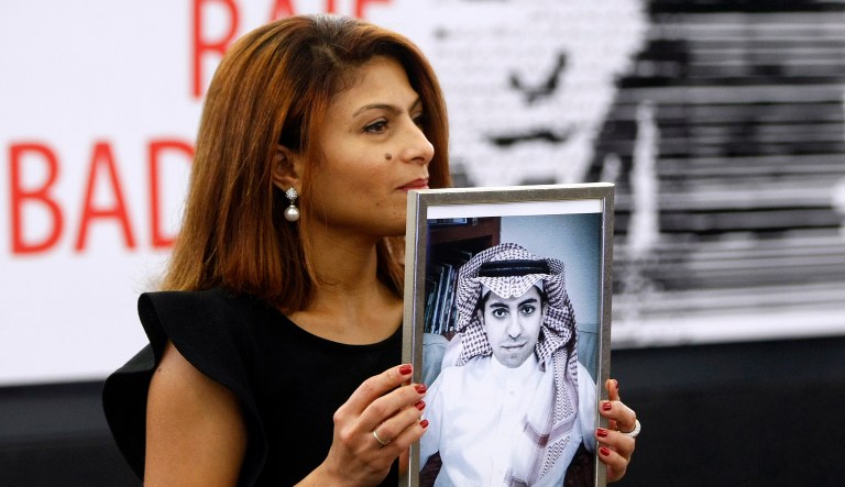 Ensaf Haidar, wife of the jailed Saudi Arabian blogger Raif Badawi, shows a portrait of her husband as he is awarded with the Sakharov Prize, Wednesday Dec, 16, 2015. The Sakharov Prize for Freedom of Thought is awarded each year by the European Parliament and honors individuals and organizations defending human rights and fundamental freedoms.