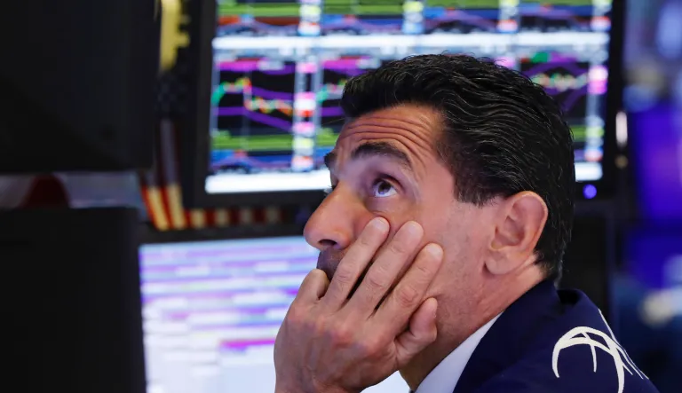Specialist Peter Mazza works at his post on the floor of the New York Stock Exchange. There are fears from some that a recession might be on the horizon given the Fed's hiking of interest rates.