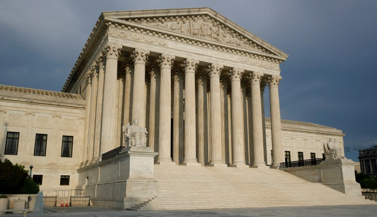 FILE - In this May 3, 2020, file photo, the setting sun shines on the Supreme Court building on Capitol Hill in Washington. The Supreme Court opens a new term Monday, Oct. 5. 