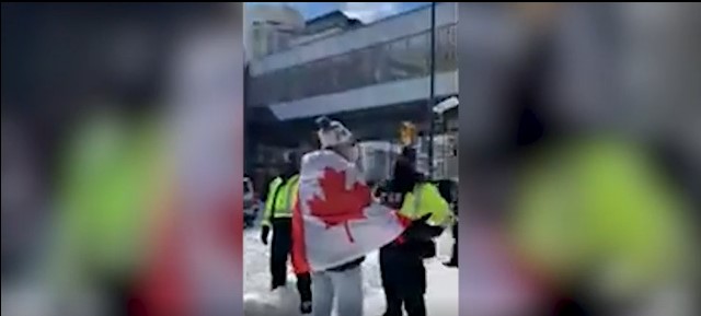 WATCH: Trucker confronts police as Ottawa on knife’s edge over COVID-19 protests