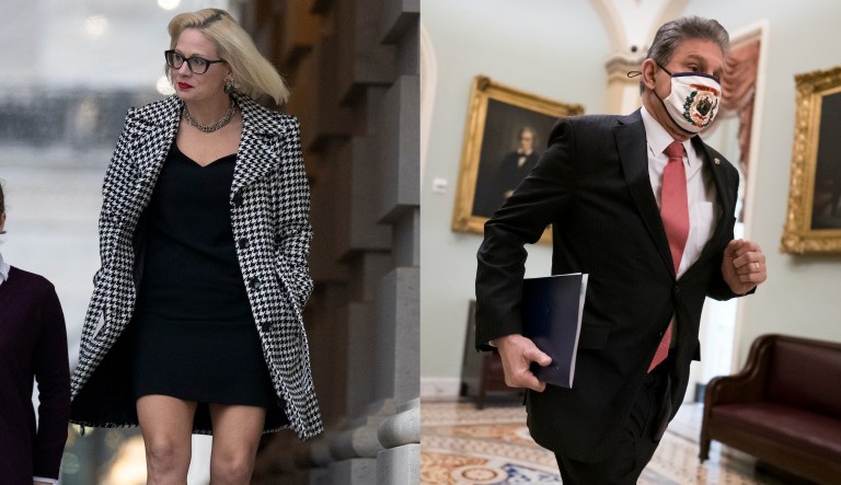 Sen. Joe Manchin (D-WV), left, walks with Sen. Kyrsten Sinema (D-AZ) on Nov. 16, 2021, on Capitol Hill in Washington. Sinema agreed to sign onto new Democratic legislation that would impose a 1% excise tax on stock buybacks.