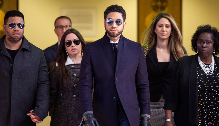 Actor Jussie Smollett, center, leaves the Leighton Criminal Courthouse in Chicago after prosecutors dropped all charges against him on Tuesday, March 26, 2019.