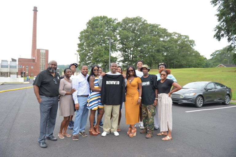 Stet Frazier, center, poses with family immediately after his release from prison on Aug. 2, 2019.