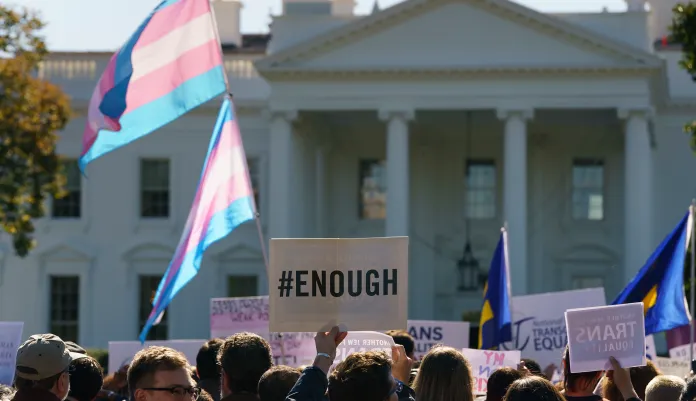 The National Center for Transgender Equality, NCTE, and the Human Rights Campaign gather on Pennsylvania Avenue in front of the White House in Washington, Monday, Oct. 22, 2018, for a #WontBeErased rally.