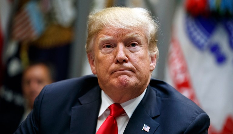 President Donald Trump listens to a question from a reporter during a meeting of the President's National Council of the American Worker in the Roosevelt Room of the White House, Monday, Sept. 17, 2018, in Washington.