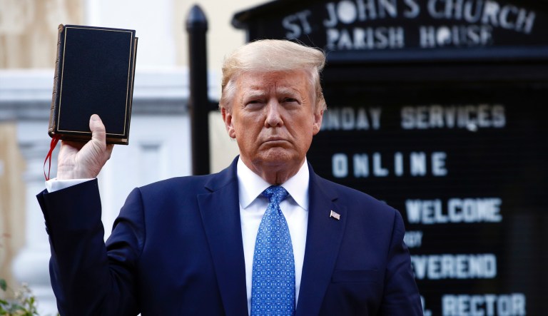President Donald Trump holds a Bible as he visits outside St. John's Church across Lafayette Park from the White House Monday, June 1, 2020, in Washington. Part of the church was set on fire during protests on Sunday night. 