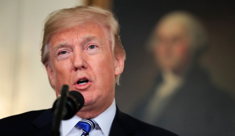 President Donald Trump speaks in the Diplomatic Room of the White House in Washington, Friday, March 23, 2018, about the $1.3 trillion spending bill.