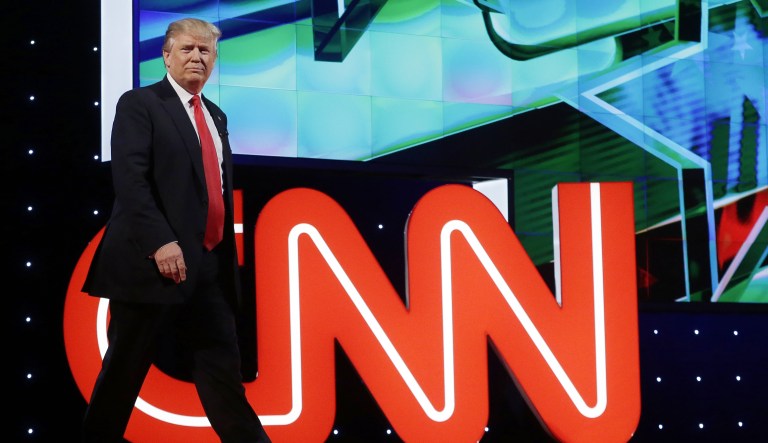 Republican presidential candidate, businessman Donald Trump  enters the debate hall during the Republican presidential debate sponsored by CNN, Salem Media Group and the Washington Times at the University of Miami,  Thursday, March 10, 2016, in Coral Gables, Fla.