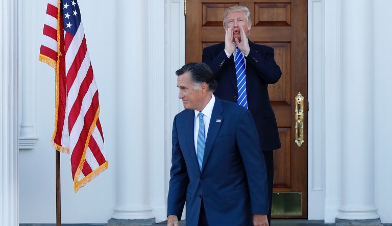 In this Nov. 19, 2016, file photo, President-elect Donald Trump calls out to the media as Mitt Romney leaves the Trump National Golf Club Bedminster in Bedminster, N.J. 