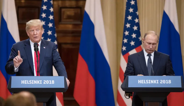 U.S. President Donald Trump, left, speaks, as Vladimir Putin, Russia's president, listens during a news conference in Helsinki, Finland, on Monday, July 16, 2018. TrumpÂ called Special CounselÂ Robert Mueller's probe into Russian election meddling a "disaster" on Monday, again questioned whether Russia interfered in the 2016 election that he won and suggested he equally trusted his national intelligence director andÂ PutinÂ -- all as he stood next to the Russian leader.