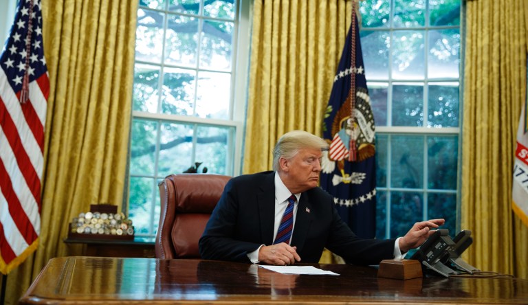 President Donald Trump talks with Mexican President Enrique Pena Nieto on the phone about a trade agreement between the United States and Mexico, in the Oval Office of the White House, Monday, Aug. 27, 2018.
