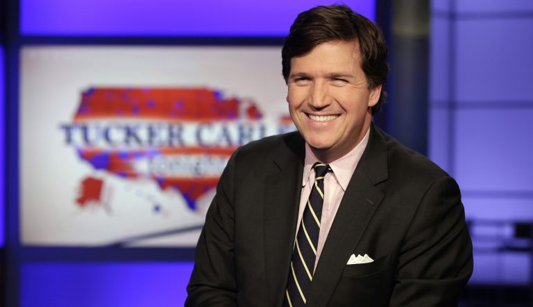 Tucker Carlson reacts during the final round of the Bedminster Invitational LIV Golf tournament in Bedminster, New Jersey on July 31, 2022.  