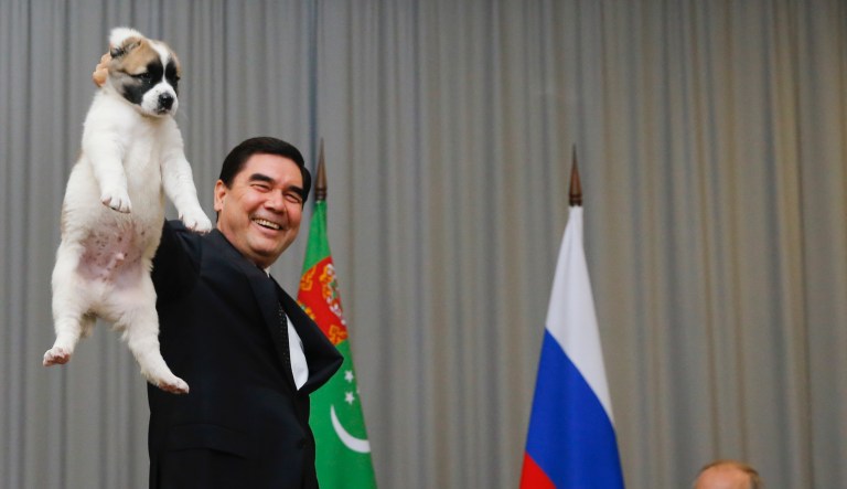Turkmenistan's President Gurbanguly Berdymukhamedov, left, presents a puppy to Russian President Vladimir Putin during their meeting in the Bocharov Ruchei residence in the Black Sea resort of Sochi, Russia, Wednesday, Oct. 11, 2017. The presidents met at the sidelines of a summit of leaders of ex-Soviet nations in Sochi. 