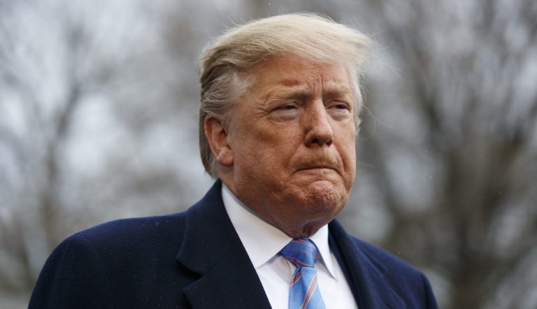 President Donald Trump pauses as he speaks with reporters before boarding Marine One on the South Lawn of the White House, Friday, April 5, 2019, in Washington. 