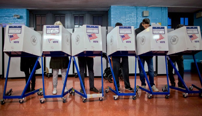 Voters in Brooklyn, New York, cast ballots in the 2016 presidential election. As worries about interference in this year's midterm vote climb, Microsoft is introducing new tools to safeguard data for candidates and campaigns. 