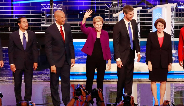 From left, New York City Mayor Bill de Blasio, Rep. Tim Ryan, D-Ohio, former Housing and Urban Development Secretary Julian Castro, Sen. Cory Booker, D-N.J., Sen. Elizabeth Warren, D-Mass., former Texas Rep. Beto OâRourke, Sen. Amy Klobuchar, D-Minn., Rep. Tulsi Gabbard, D-Hawaii, Washington Gov. Jay Inslee, and former Maryland Rep. John Delaney pose for a photo on stage before the start of a Democratic primary debate hosted by NBC News at the Adrienne Arsht Center for the Performing Arts, Wednesday, June 26, 2019, in Miami.