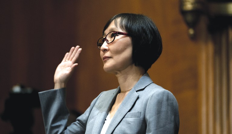 Saule Omarova of New York is sworn in during a Senate Banking, Housing, and Urban Affairs hearing on Capitol Hill in Washington to examine her nomination to be the Comptroller of the Currency, Thursday, Nov. 18, 2021.