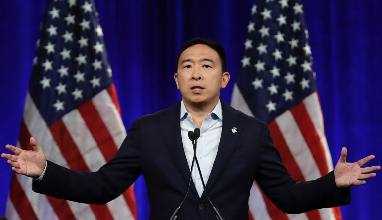Democratic presidential candidate Andrew Yang gestures while speaking at the Democratic National Committee's summer meeting Friday, Aug. 23, 2019, in San Francisco. More than a dozen Democratic presidential hopefuls are making their way to California to curry favor with national party activists from around country. Democratic National Committee members will hear Friday from top contenders, including Elizabeth Warren, Kamala Harris and Bernie Sanders. 