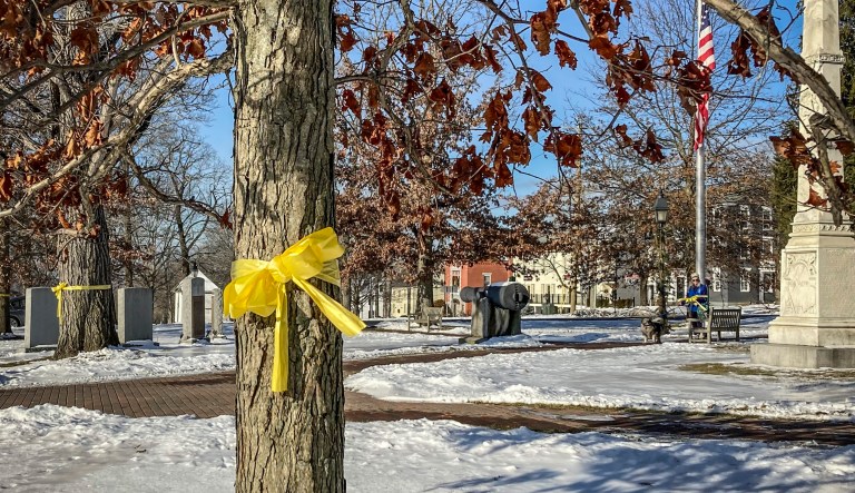 Yellow ribbons symbolizing support for the troops removed from town square