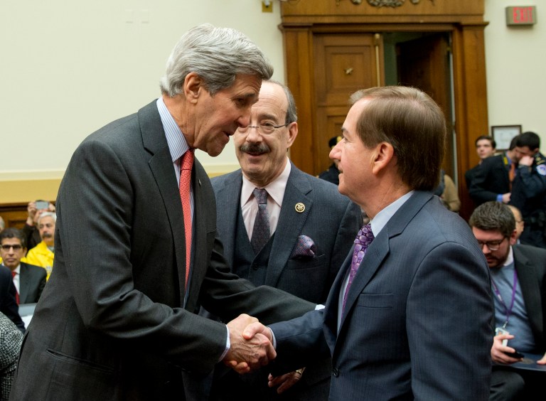 Secretary of State John Kerry, left, shakes hands with House Foreign Affairs Committee Chairman Rep. Ed Royce, R-Calif., right, as the committee's ranking member Rep. Eliot Engel, D-N.Y., watches at center, on Capitol Hill in Washington, Wednesday, Feb. 25, 2015, prior to Kerry testifying before the committee. (AP Photo/Carolyn Kaster)