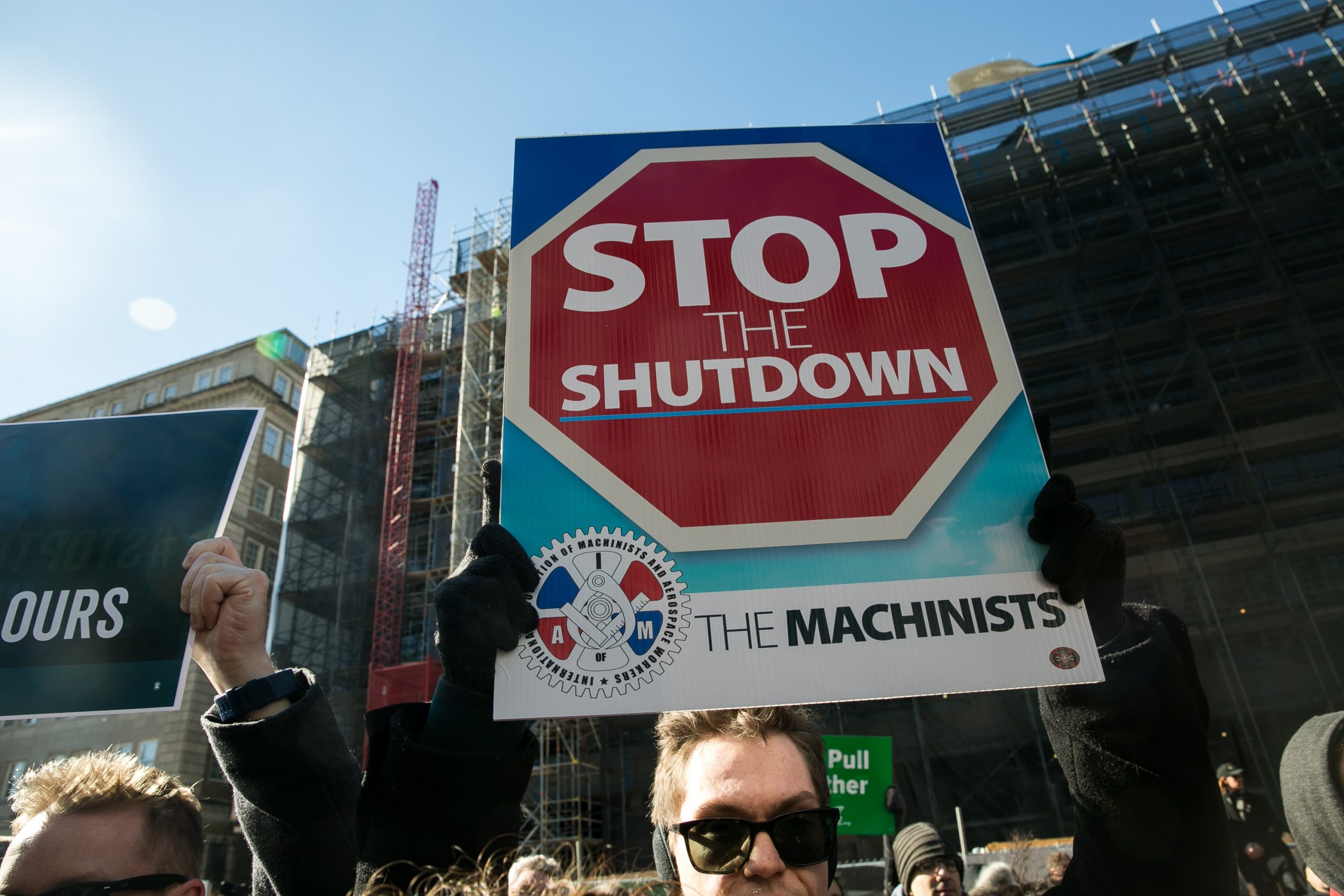 Union members and other federal employees rally to call for an end to the partial government shutdown on Thursday outside the White House. 