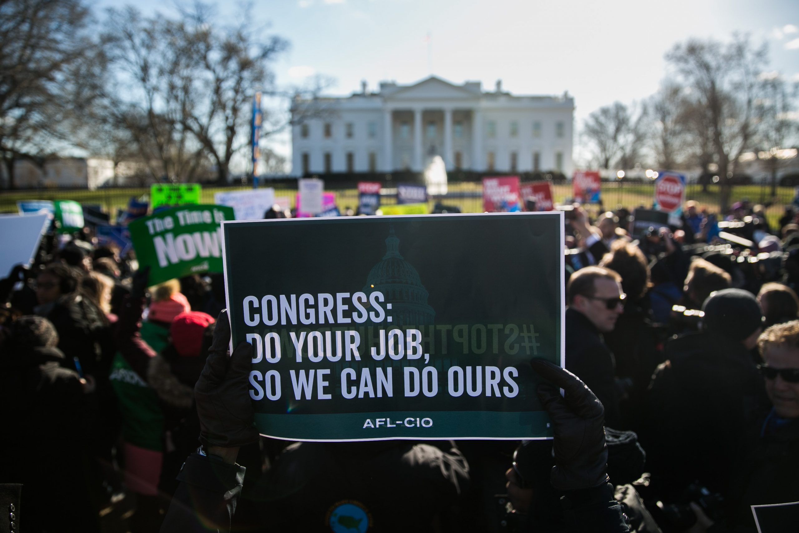 Union members and other federal employees rally to call for an end to the partial government shutdown on Thursday outside the White House. 